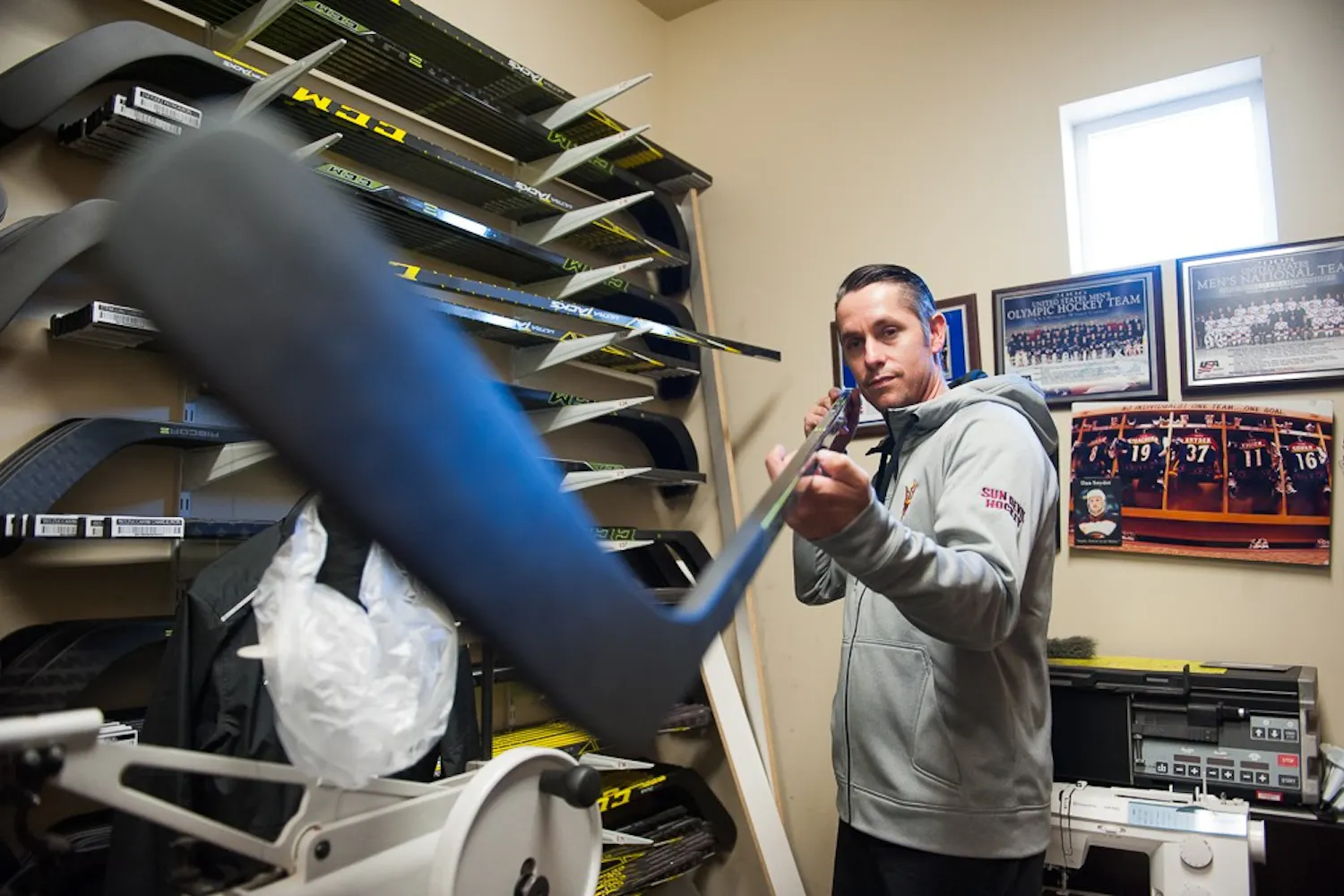 ASU hockey equipment manager Joey Guilmet poses for a portrait in his workshop on Wednesday, Oct. 7, 2015, at Oceanside Ice Arena in Tempe.