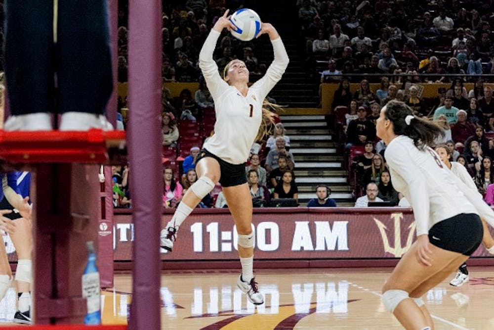 Junior setter Bianca Arellano sets the ball for junior middle blocker Whitney Follette against the University of Washington, Friday, Oct. 17 at Wells Fargo Arena in Tempe. The Huskies swept the Sun Devils, 3-0.