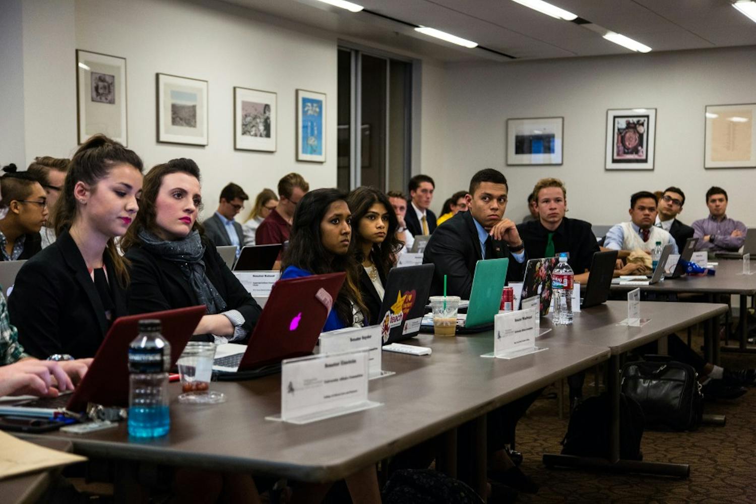 Members of the Tempe USG listen to Senior Senate President Will Smith (not pictured) discuss the agenda at the Memorial Union on Jan. 27, 2015. (Daniel Kwon/ The State Press)