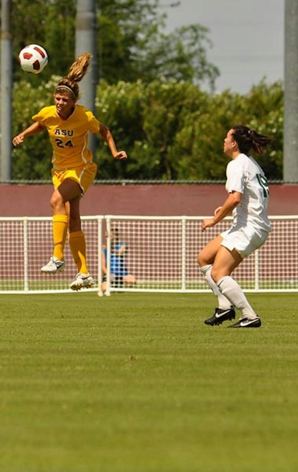 OFF THE GROUND: Freshman defender/midfielder Kaitlyn Pavlovich heads a ball against Baylor. The Sun Devils open Pac-10 play Friday against Washington State after scoring zero goals in their last three games. (Photo by Aaron Lavinsky)