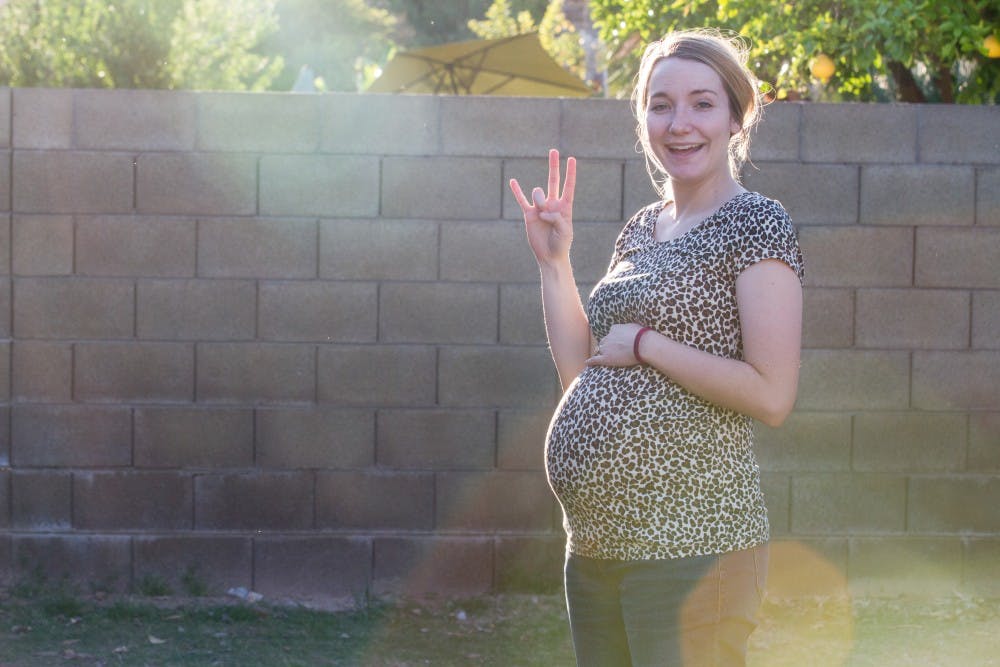 ASU human and family development senior Cassie Mortensen poses for a photo in her eighth month of pregnancy in Chandler, Arizona on Sunday, March 19, 2017.&nbsp;