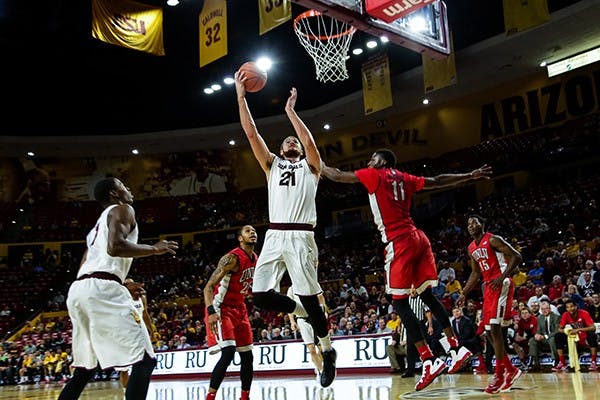ASU junior forward Eric Jacobsen scores a layup early in the first half during the ASU vs UNLV game on Dec. 3rd, 2014 at the Wells Fargo Arena. Jacobsen would command the post scoring 16 points to lead the Sun Devils to a 77-55 victory over the Runnin Rebels. (Photo by Daniel Kwon)