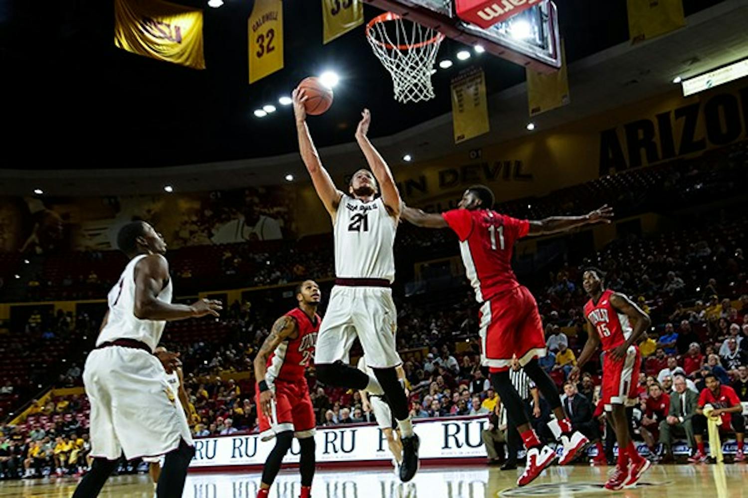 ASU junior forward Eric Jacobsen scores a layup early in the first half during the ASU vs UNLV game on Dec. 3rd, 2014 at the Wells Fargo Arena. Jacobsen would command the post scoring 16 points to lead the Sun Devils to a 77-55 victory over the Runnin Rebels. (Photo by Daniel Kwon)