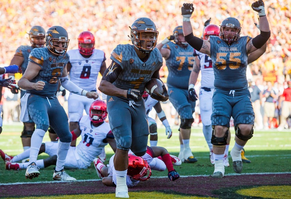 Sophomore running back Demario Richard (4) scores a touchdown against UA on Saturday, Nov. 21, 2015, at Sun Devil Stadium in Tempe.