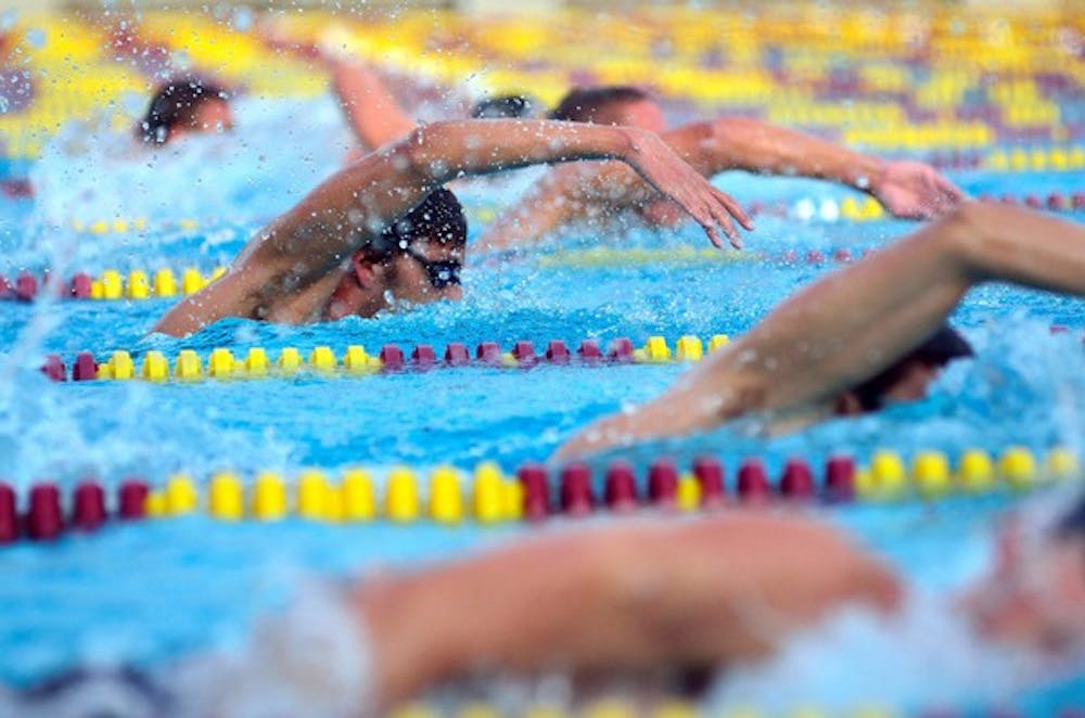 MAKING WAVES: Members of the ASU swim team compete in practice last week. After mixed results at the UA duals meet, both the men's and women's teams are looking for ways to improve as the season picks up. (Photo by Aaron Lavinsky)