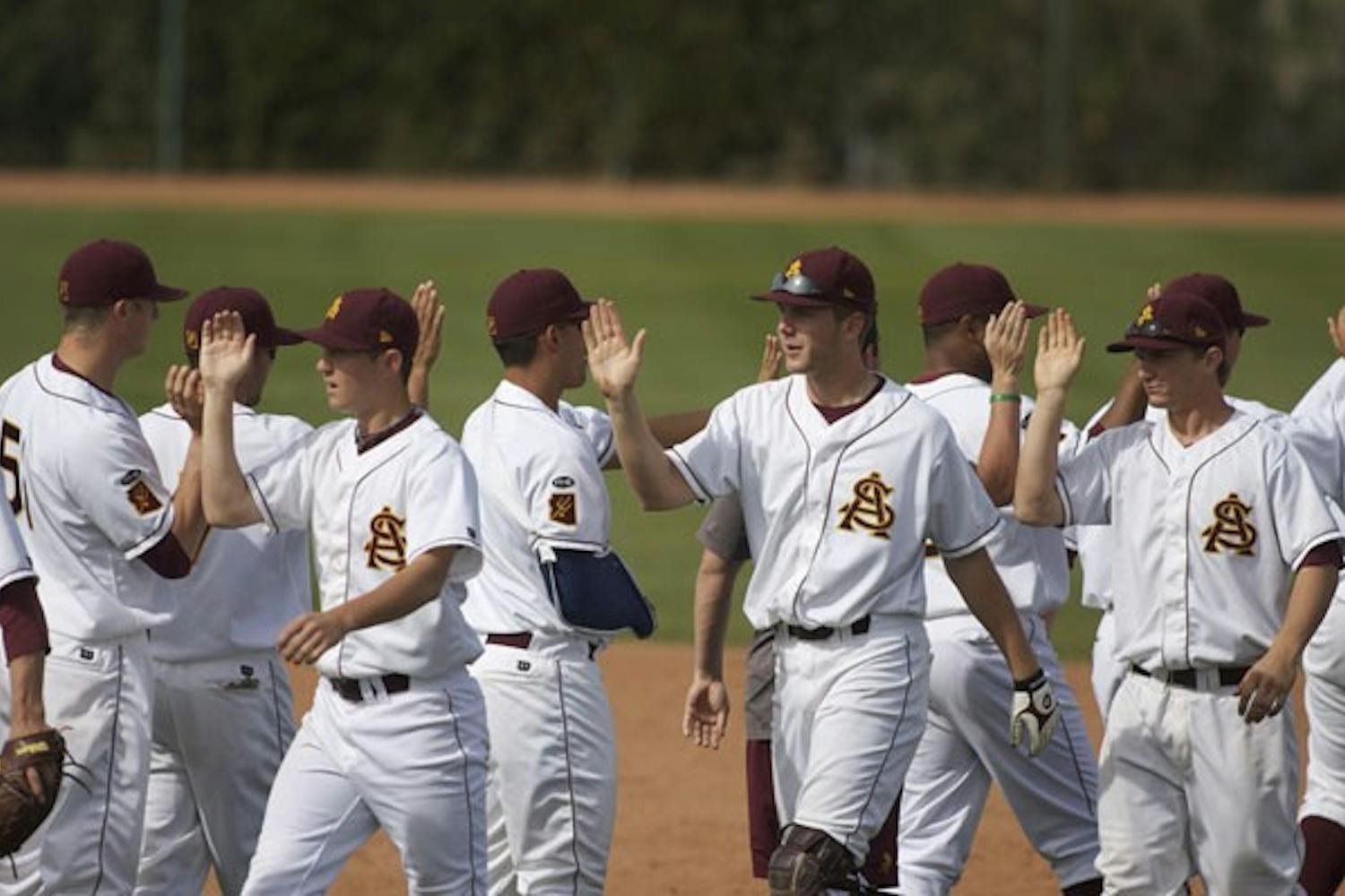 STILL PERFECT: The ASU baseball team celebrates after its 6-0 win over Houston on Saturday at Packard Stadium. The Sun Devils also beat Houston 6-5 on Sunday to push their record to 20-0 to start the season. (Photo by Scott Stuk)