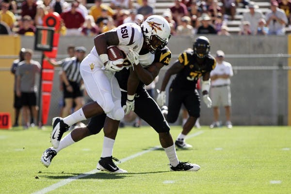 James Morrison carries the ball in a scrimmage on March 31. Morrison considered transferring schools last fall, but has played well in Cameron Marshall’s absence this spring. (Photo by Sam Rosenbaum)