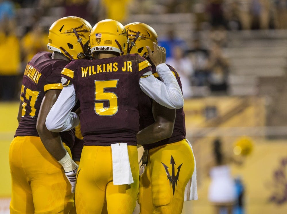 ASU players celebrate after a touchdown during a game against Northern Arizona University in Tempe, Arizona, on Sept. 3, 2016. The Sun Devils won the matchup, 44-13.