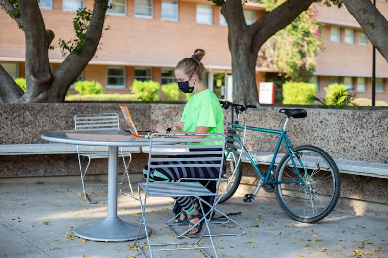 ASU microbiology junior Caroline Williams works on an assignment with their mask on the Tempe campus on Thursday, Aug. 20, 2020.