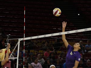 A Washington volleyball player sets the ball in their game against the ASU Sun Devils on Oct. 21, 2016 in Tempe, Ariz.