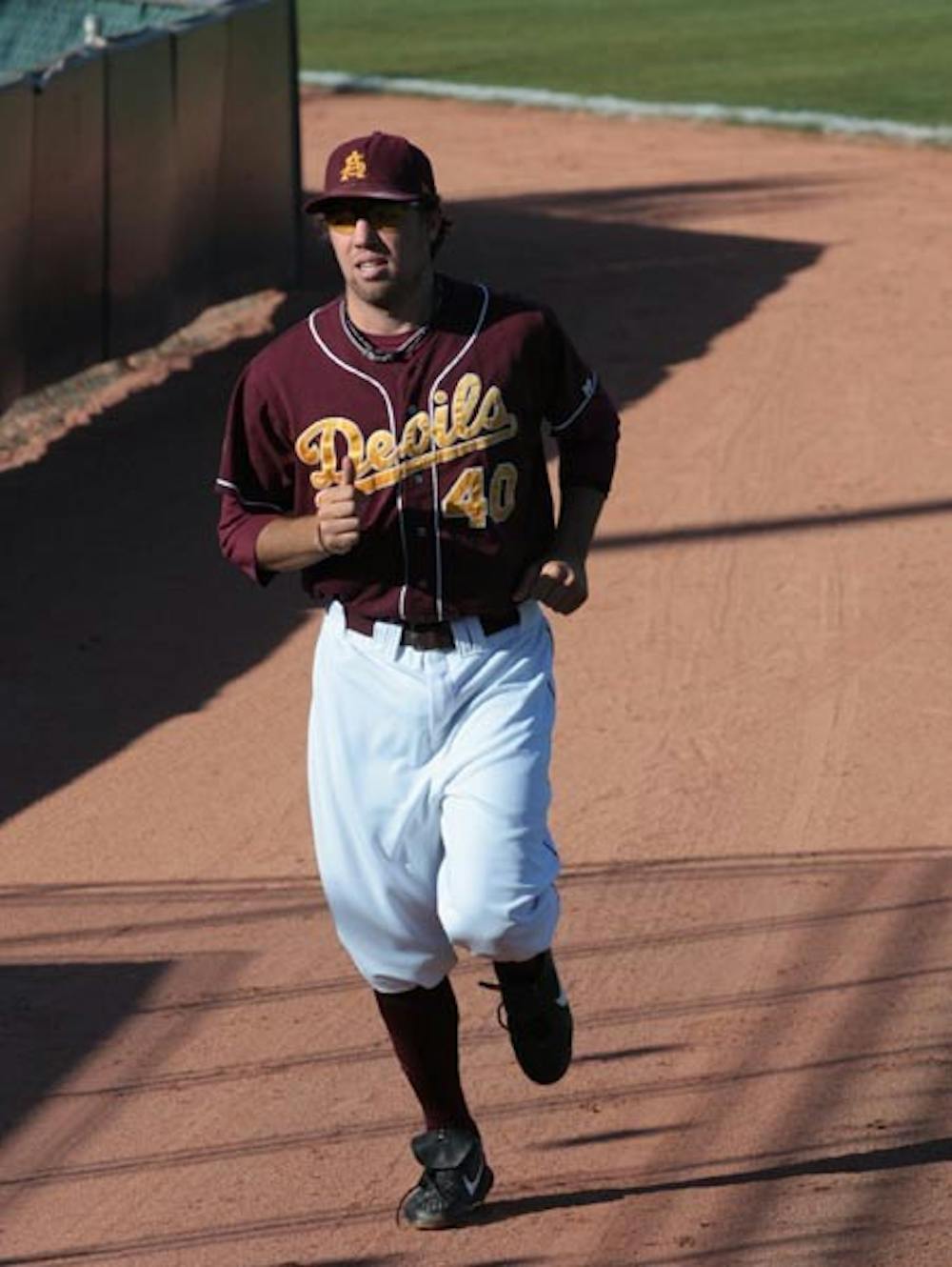 NEW YEAR EXCITEMENT: Junior pitcher Mitchell Lambson, shown jogging, is one of several returning players from the Pac-10 champion squad excited for the upcoming season. ASU coach Tim Esmay, coming off a 52-10 record in his first year at the helm, understands the winning expectations associated with his team, and the pressure that accompanies it. (Photo by Nick Kosmider)