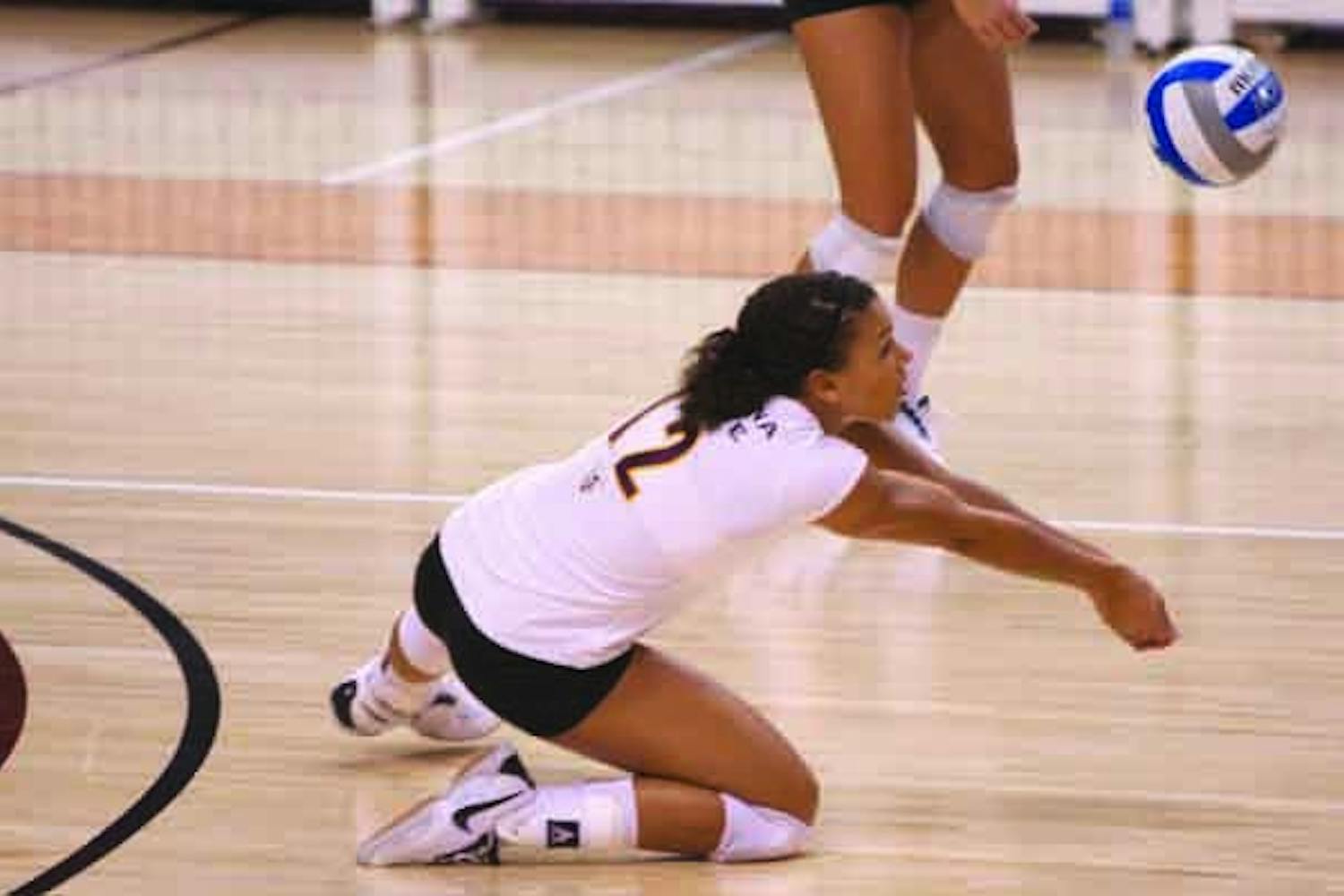 RECORD BREAKER: Senior outside hitter Sarah Reaves digs a ball during last weekendís ASU Sheraton Classic.  Reaves moved into fifth all time on ASUís kills list after hitting 19 kills against High Point Friday. (Photo by Scott Stuk)