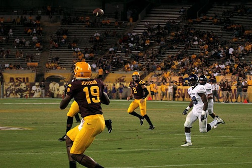 Redshirt junior quarterback Mike Bercovici successfully throws the to redshirt freshman wide receiver Ellis Jefferson in a home game against Weber State on Aug. 28. ASU won against Weber State 45-14. (Photo by Alexis Macklin)