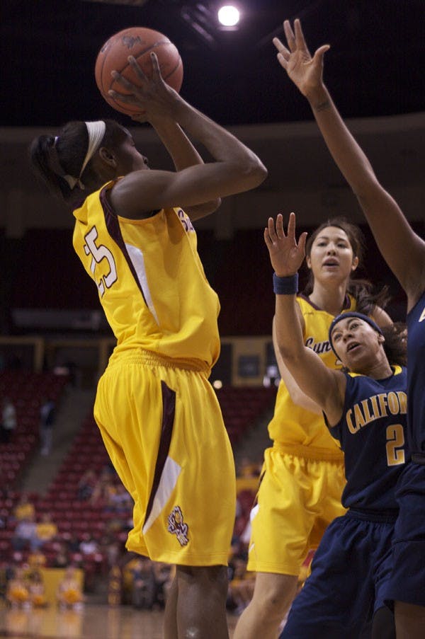 MAKE IT COUNT: Sophomore Kimberly Brandon shoots over two defending Cal State players in the Devils' 57-50 win. (Photo by Scott Stuk)