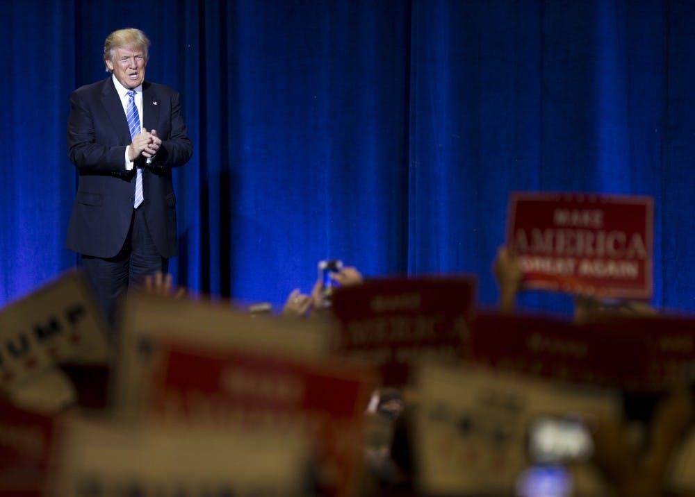 Donald Trump takes the stage during his campaign stop at the Phoenix Convention Center in Phoenix, Arizona, on Wednesday, Aug. 31, 2016. 