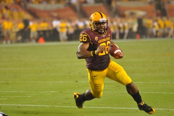 Favorable Schedule: ASU junior Brock Osweiler takes a snap during the Sun Devils’ OT victory over UA on Dec. 2. This year ASU football has a good chance at winning the Pac-12 south, and will likely be competing with the Wildcats for that title.  (Photo by Aaron Lavinsky)