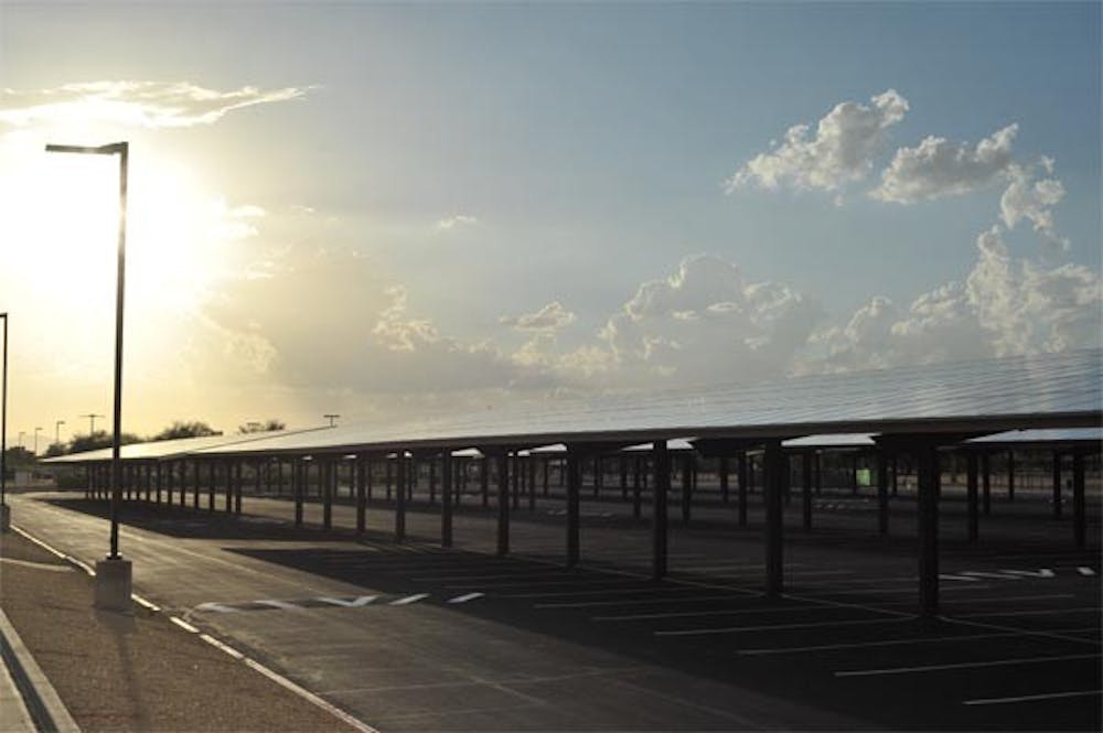 SUN SHADE: New Solar panels at the ASU West campus have been installed in the campus parking lots, adding to ASU's sustainability and providing shade as a bonus. (Photo by Chris Stark)