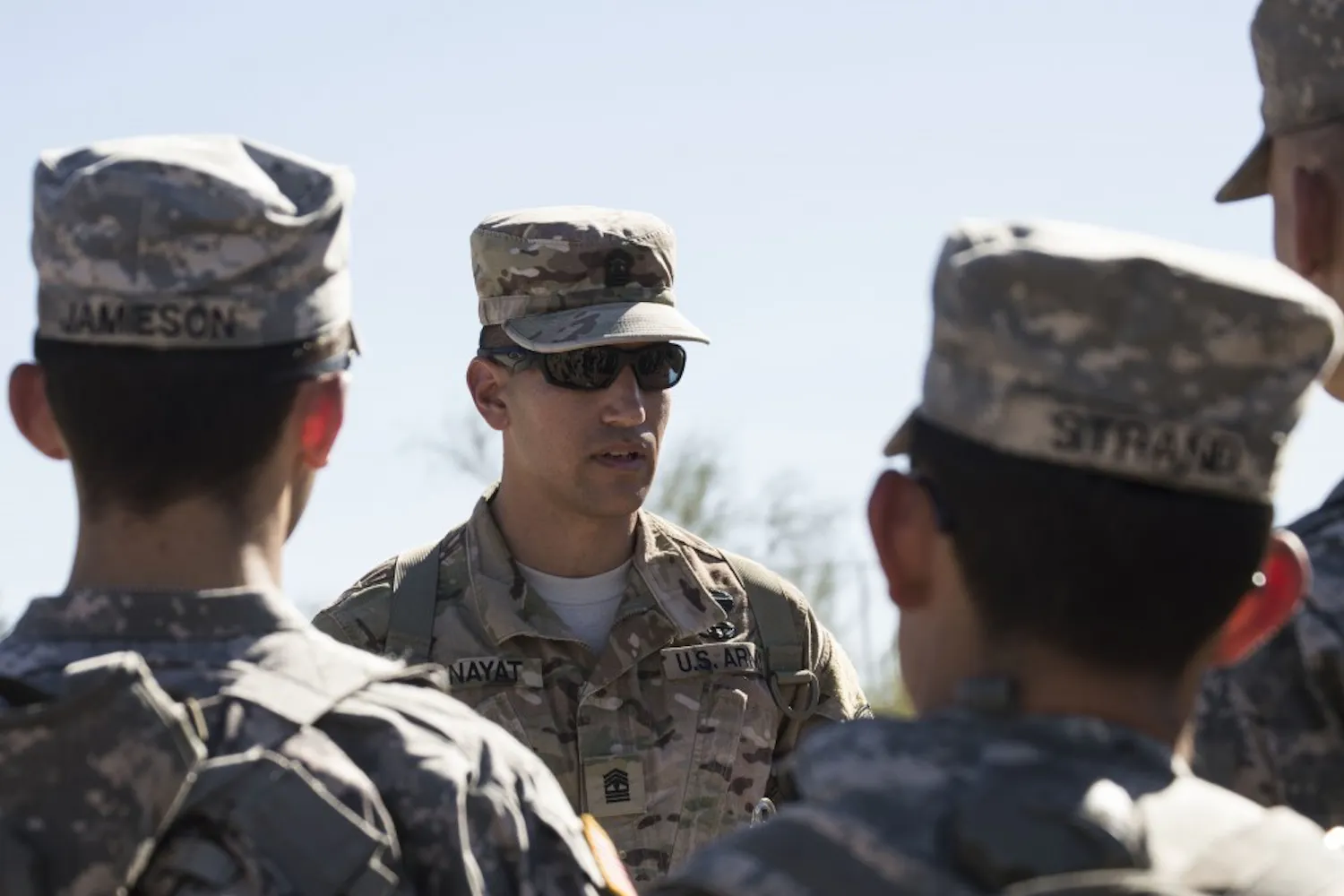 Arizona State University ROTC members listen intently before performing their next drill at Papago Military Reservation in Phoenix, Ariz. on Saturday, Oct. 24, 2015.
