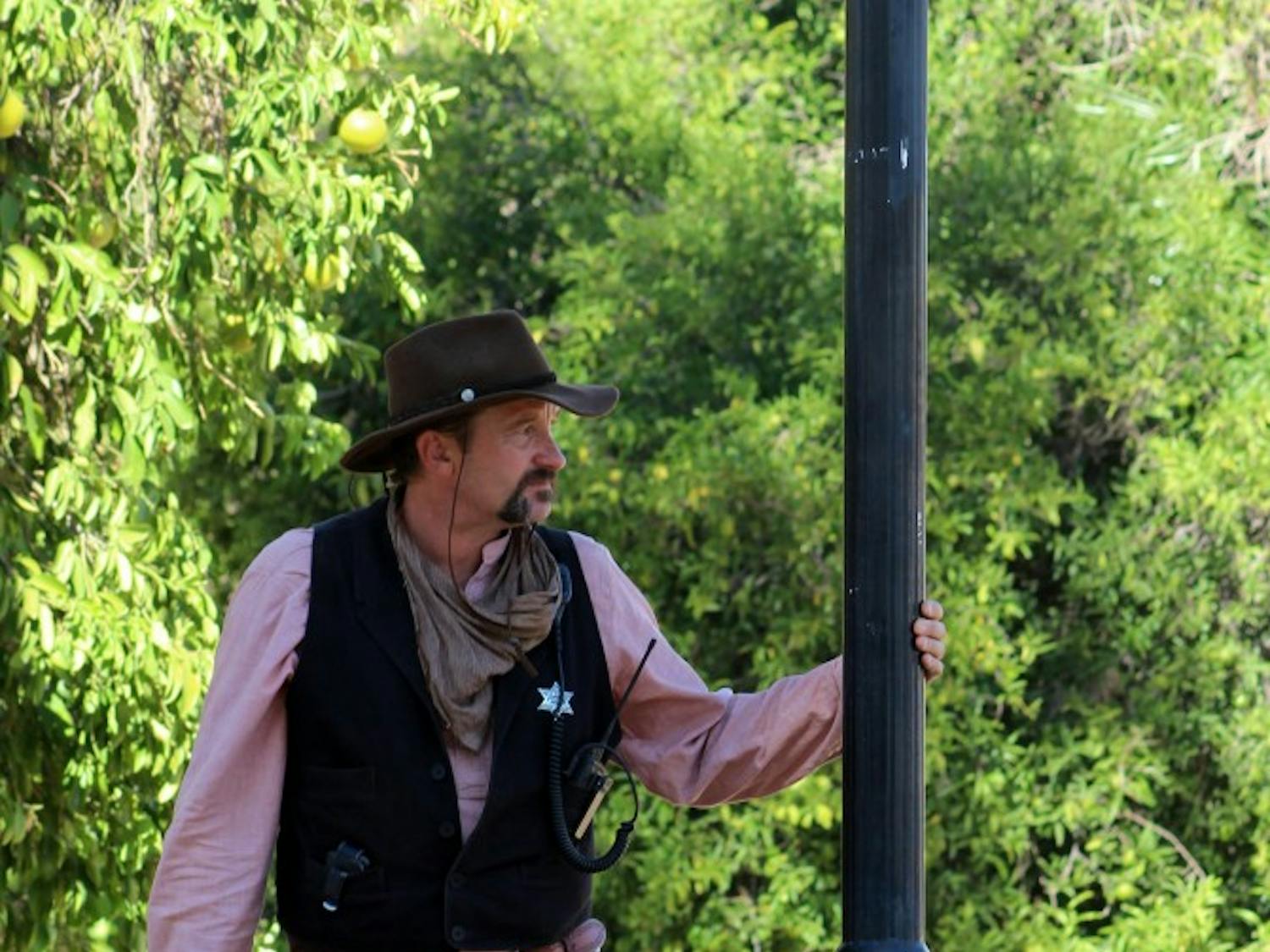 Tom B. Stone, a theatrical character and member of a variety act, sips on some sarsaparilla.