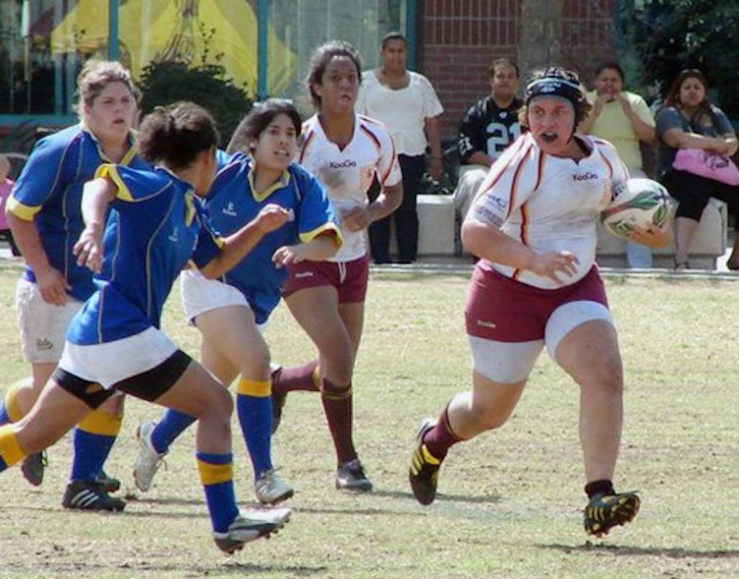Mikayla Gilbert of the Sun Devils’ women’s rugby team drives up field in a January 2011 match against UCLA. (Photo courtesy of ASU WRFC)