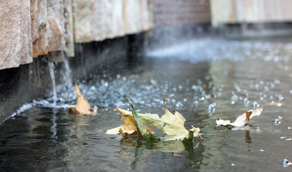 LEAF BOATS: Fallen leaves swirl around in a fountain outside the Fulton Center Oct. 20. (Photo by Beth Easterbrook)