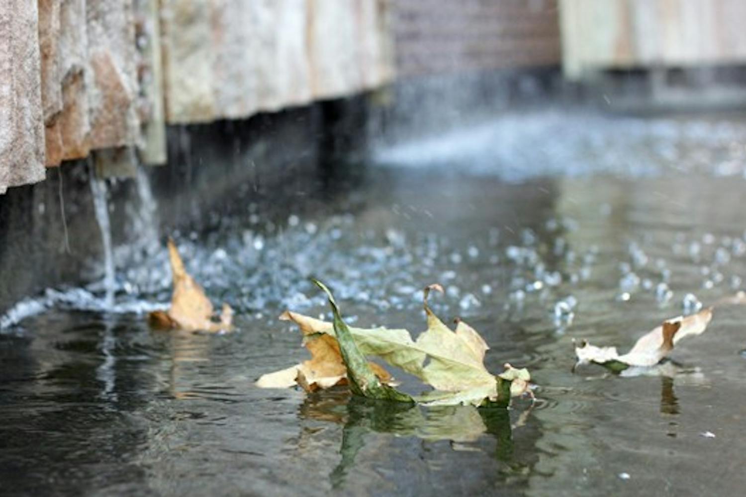 LEAF BOATS: Fallen leaves swirl around in a fountain outside the Fulton Center Oct. 20. (Photo by Beth Easterbrook)