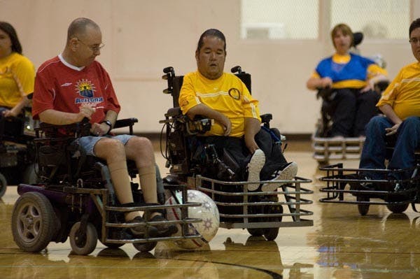NO ASSIST NEEDED: German graduate student Tony Jackson (right) part of the Sun Devil Power Soccer Club, works on getting the ball from a member of an opponent in Friday night's 5-0 win against AZ Heat. (Photo by Aaron Lavinksy)