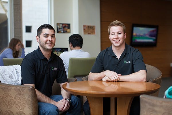 Executive director, Christopher Mendezona (left) and co-founder, Jeff Wells (right) of Arizona Microcredit Initiative (AMI) tells us how they are seeing huge successes with supporting local businesses. AMI was founded by a small group of honors students to help small businesses with their start-ups. (Photo by Ryan Liu)