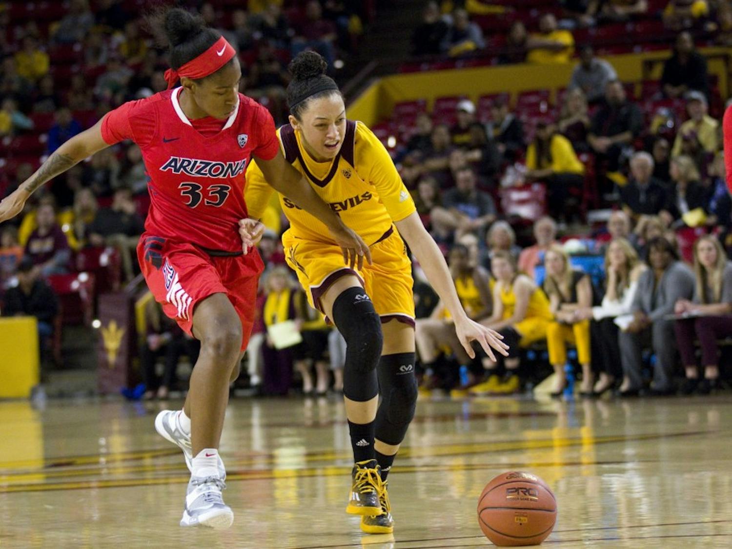 ASU freshman guard Reili Richardson (1) dribbles the ball while being pushed by Wildcats guard JaLea Bennett during a women's basketball game against the University of Arizona Wildcats in Wells Fargo Arena in Tempe, Arizona on Sunday, Feb. 19, 2017. ASU won the game 67-54. (Josh Orcutt/State Press)