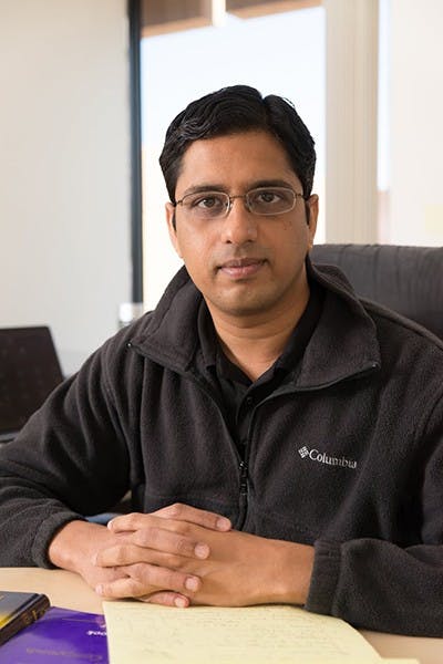 Assistant professor Jagannathan Rajagopalan poses at his office in the Engineering Research Center. Rajagopalan designed the structure for biohybrid swimmers. (Photo by Andrew Ybanez)
