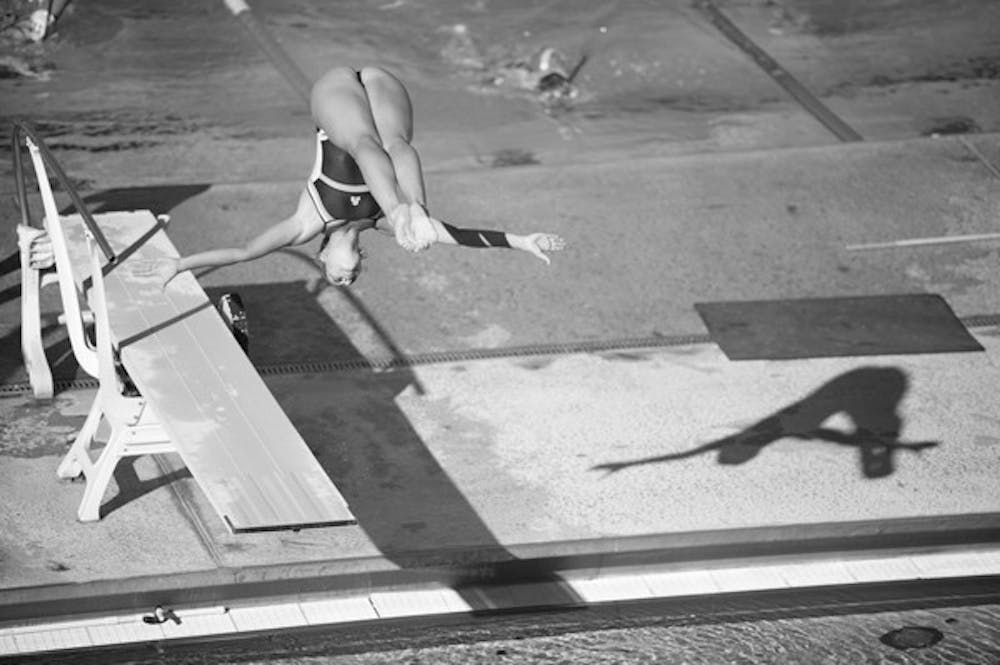 Great finish: Junior Elina Eggers comes out of her tuck during a dive at a practice in January. Eggers finished second on the platform at the NCAA national championships. (Photo by Michael Arellano)