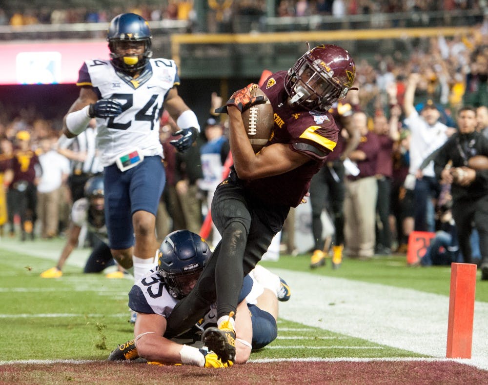 Redshirt junior wide receiver Tim White (12) scores a touchdown against West Virginia during the Motel 6 Cactus Bowl on Saturday, Jan. 2, 2016, at Chase Field in Phoenix.