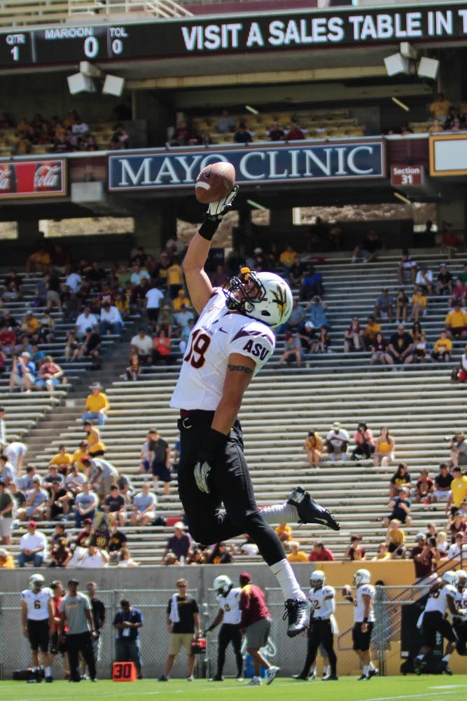 Redshirt junior defensive back Jordan Simone leaps for a catch in warmups during the Sun Devils' Fan Fest on April 13, 2013. Simone is one is one of only two returning defensive starters from last season. (Photo by Dominic Valente)