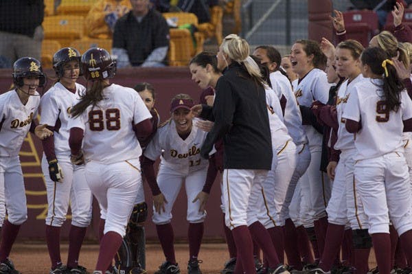 DUCK HUNTERS: The ASU softball team celebrates a home run by sophomore outfielder Anniw Lockwood during the Sun Devils' loss to Kentucky earlier this season. ASU will face Oregon in a three-game series beginning Friday night at Farrington Stadium in Tempe. (Photo by Scott Stuk)