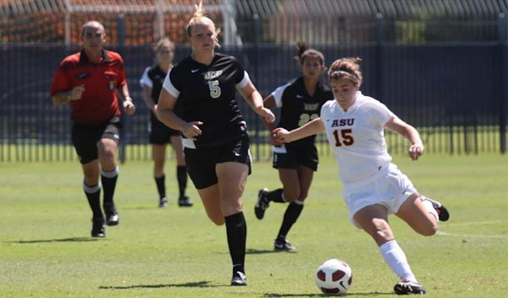 BOUNCING BACK: Freshman midfielder Holland Crook maneuvers past Central Florida midfielder Brianna Schooley during last weekend's 5-0 loss. The Sun Devils hope to rebound on the road this weekend against Pepperdine and Long Beach State. (Photo by Beth Easterbrook)