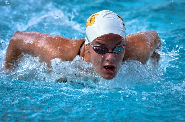 FIGHTING FORWARD: ASU junior Caroline Kuczynski takes a breath during a butterfly race against Wisconsin last Saturday. The Sun Devils begin their Pac-12 season against UCLA, USC and Miami divers on Veterans Day weekend. (Photo by Aaron Lavinsky)