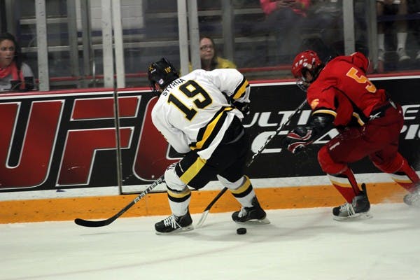 RESILIENCE: ASU junior forward Dan Styrna cuts off Iowa State junior defenseman Justin Wilkinson during Saturday’s match against the Cyclones. After a dominant first game, the Sun Devils gave up a close loss to ISU on Saturday. (Photo by Lisa Bartoli)