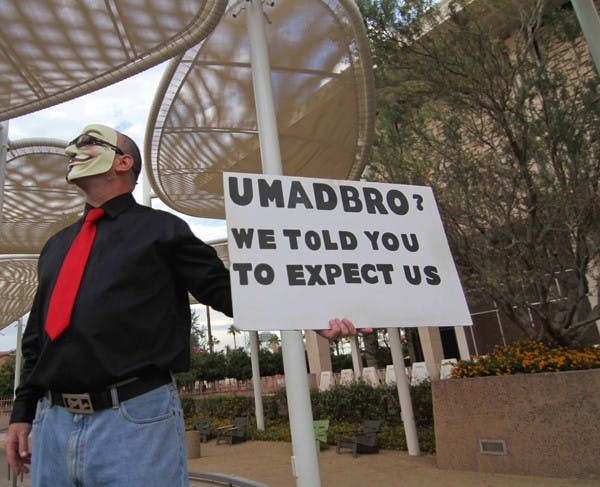 STUDENT ACTIVISTS: Protesters gathered on the stage in front of the Memorial Union Monday afternoon to show support for the Occupy movement, a branch off of the original protest in New York for over a month. (Photo by Lisa Bartoli)