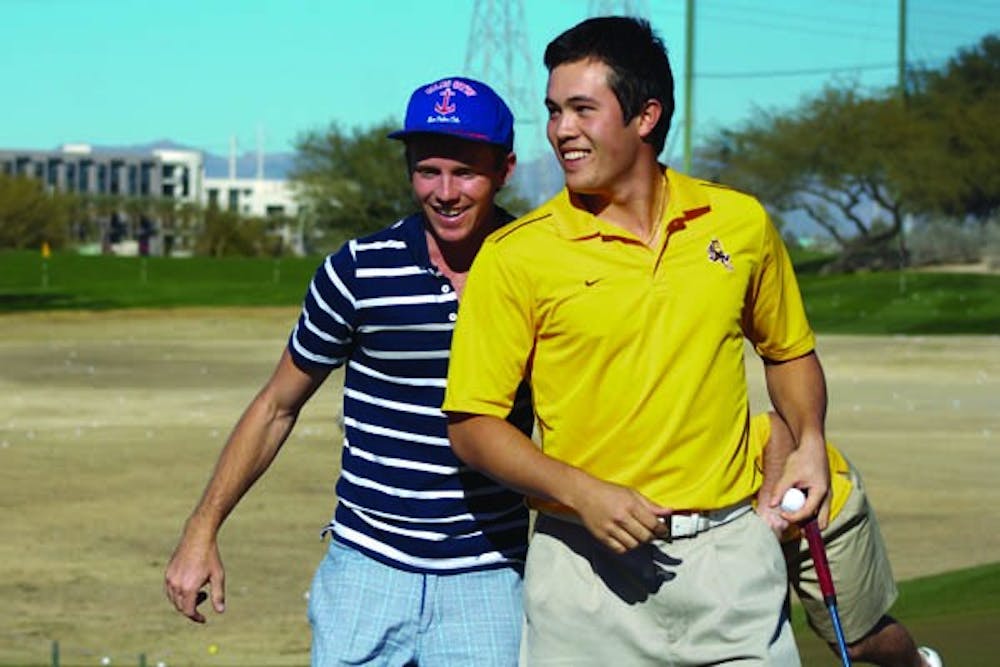 Late Collapse: ASU senior James Byrne and junior Philip Francis share a conversation during practice on Jan. 26. The Sun Devils battled tough winds and a rough final round to finish tied for seventh place at the Amer Ari Invitational in Hawaii. (Photo by Lisa Bartoli)
