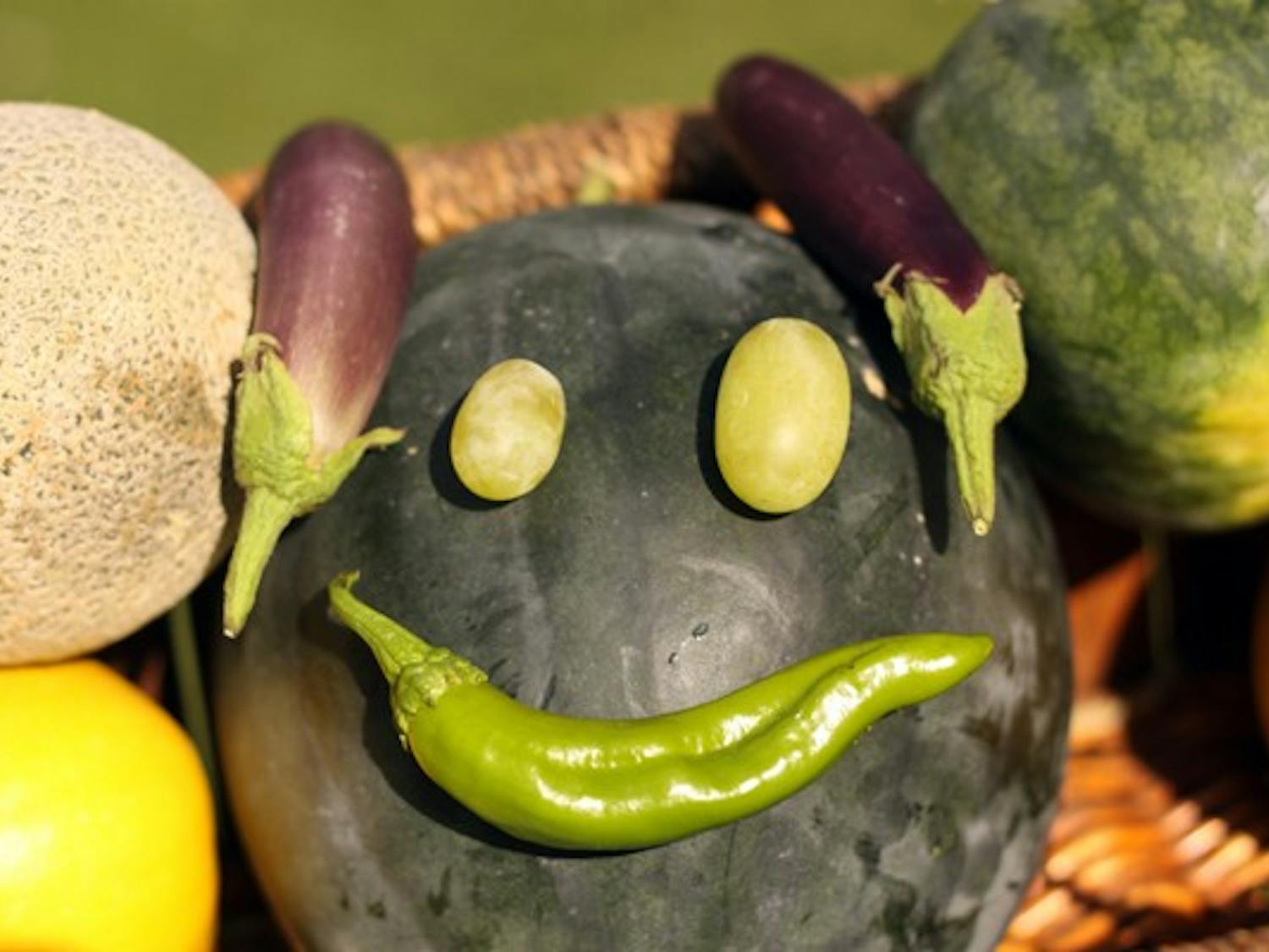 HAPPY FACE: Fruits and vegetables are arranged into a smiley face at the farmers market on the Tempe campus. (Photo by Lillian Reid) 
