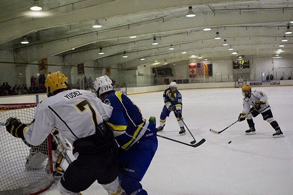 Forward Patrick Yudez battles with a player from Delaware at a game in Tempe. The ASU hockey team defeated Colorado with a 3-2 victory this weekend. (Photo by Dominic Valente)