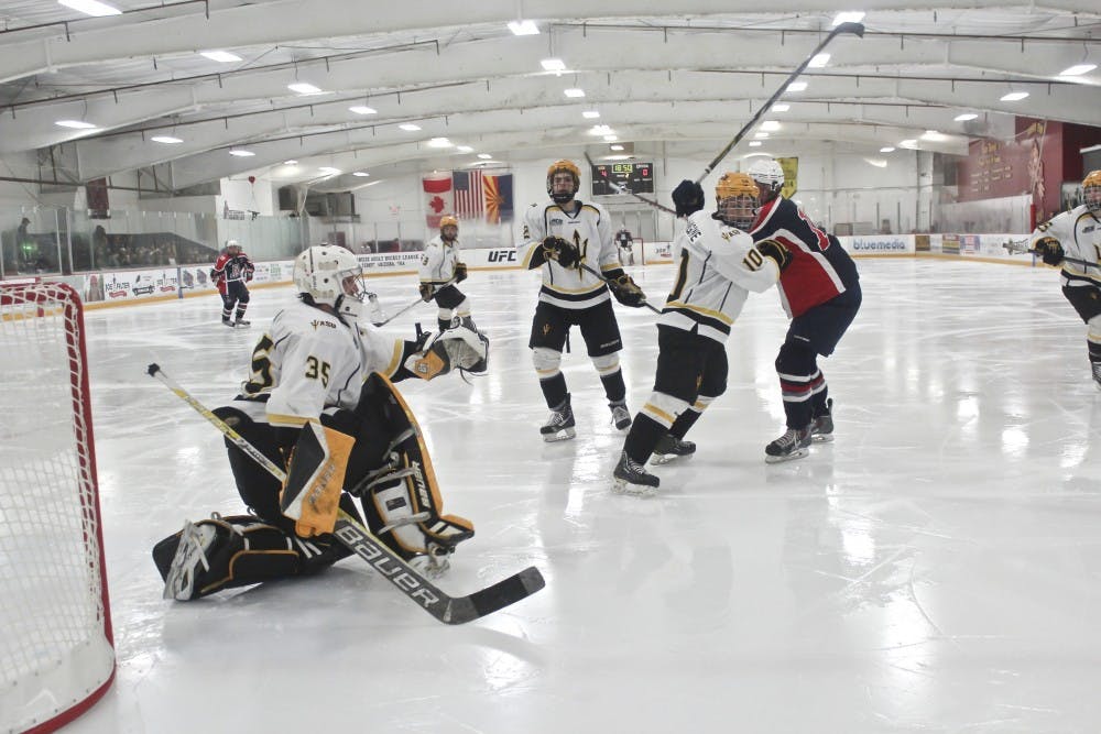 Sophomore goalie Robert Levin and sophomore defenseman Troy Hoban defend ASU’s net, crushing U of A 7-0 on Jan. 30, 2015 at Ocean Side Arena in Tempe. (Kat Simonovic/ The State Press)