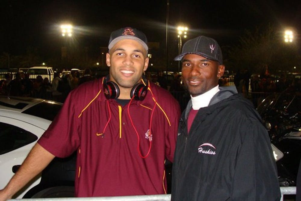 Colin Parker stands with his father, Anthony, after ASU’s victory over USC in 2010. ASU won 43-22. (Photo courtesy of Colin Parker)
