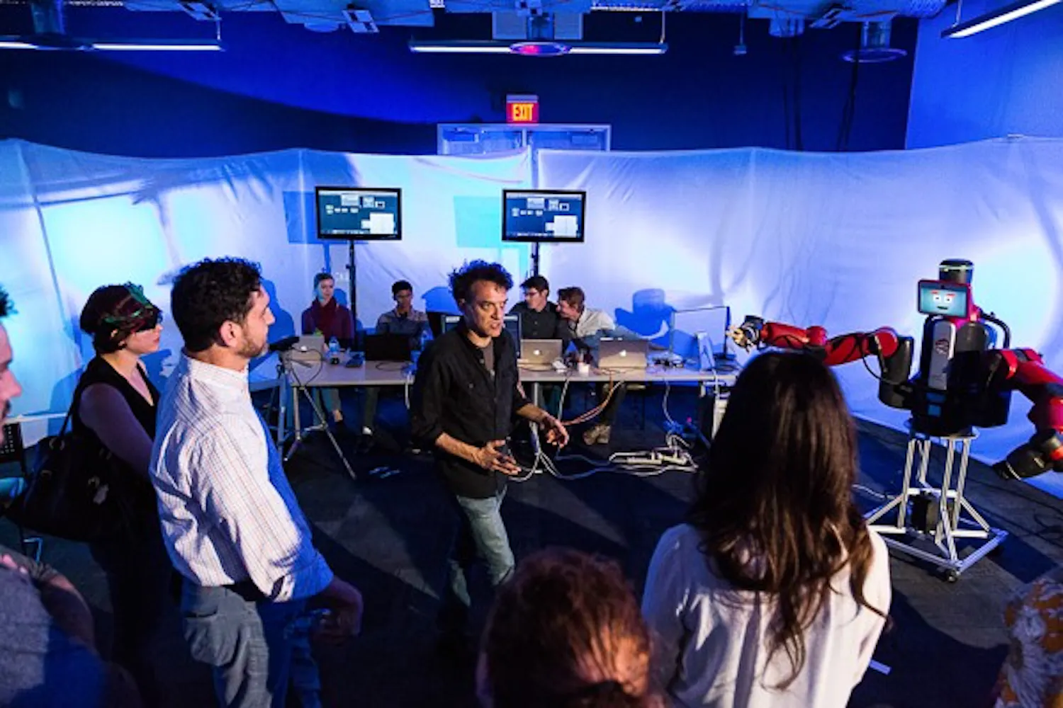 ASU associate professor Lance Gharavi leads a discussion with the audience on the potential of robots in the future at the Emerge 2015 event held at Skysong in Scottsdale, Arizona. (Daniel Kwon/The State Press)