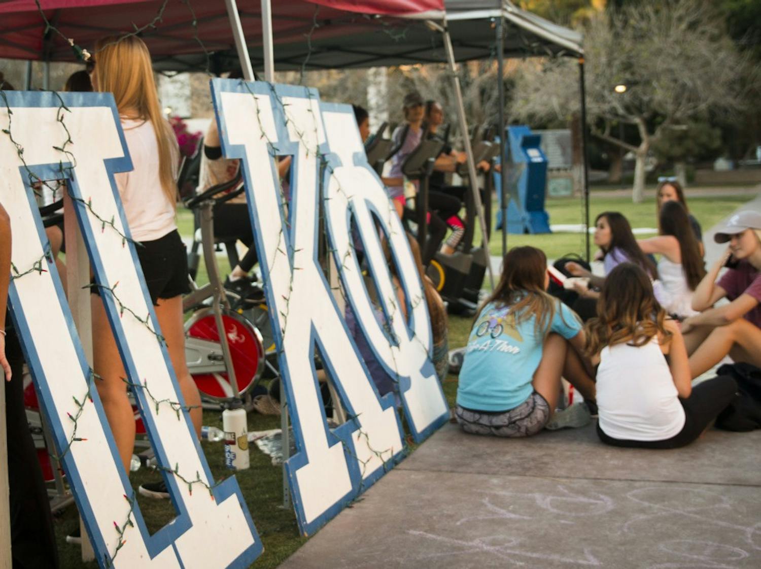 ASU students participate in Pi Kappa Phi's annual event, Bike-A-Thon, at Hayden Lawn at ASU's Tempe campus on Wednesday, March 29, 2017.