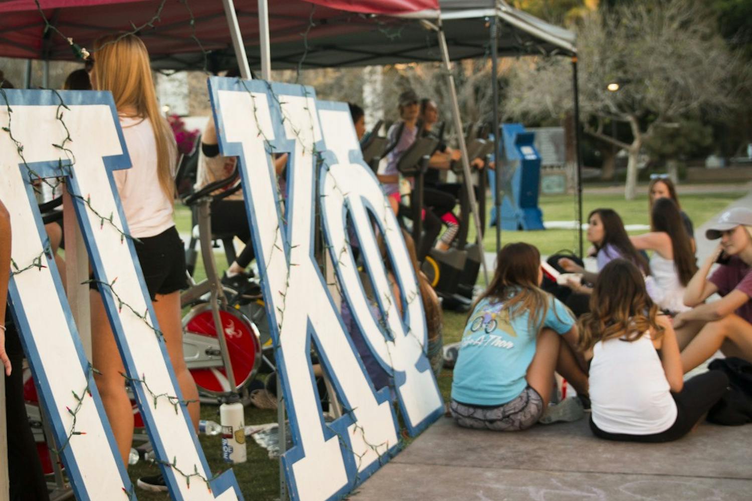 ASU students participate in Pi Kappa Phi's annual event, Bike-A-Thon, at Hayden Lawn at ASU's Tempe campus on Wednesday, March 29, 2017.