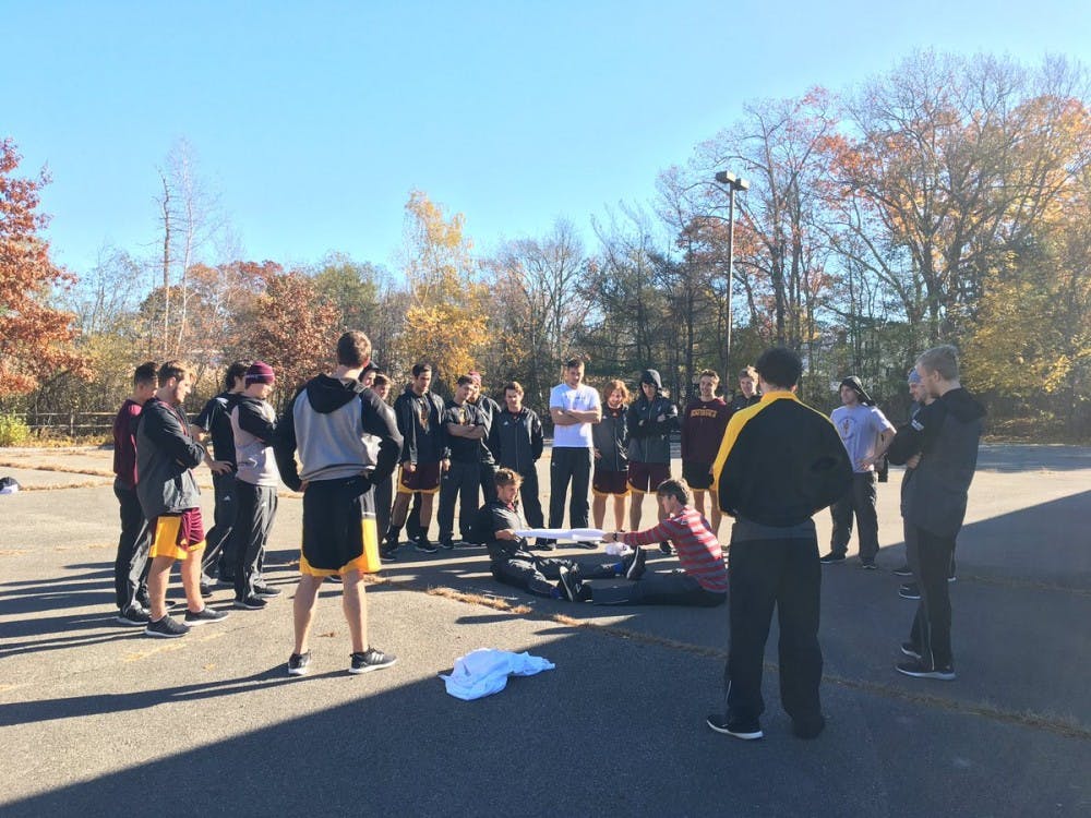 Sun Devil hockey players perform calisthenics in the parking lot of a hotel in Boston, Massachusetts&nbsp;while on the road.