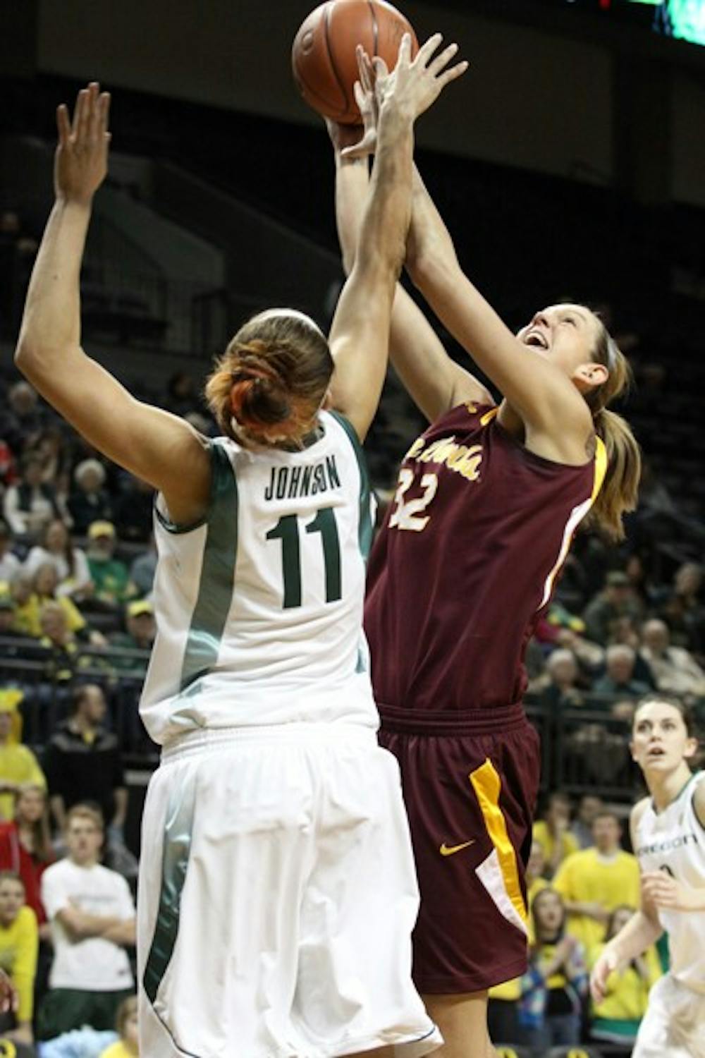 Scoring Barrage: ASU senior Becca Tobin attempts a layup over Oregon junior forward Amanda Johnson during the Sun Devils 75-66 victory over the Ducks in Eugene. Tobin scored 15 points in the game, which was good for third best on the team. (Photo Courtesy of Steve Rodriguez)