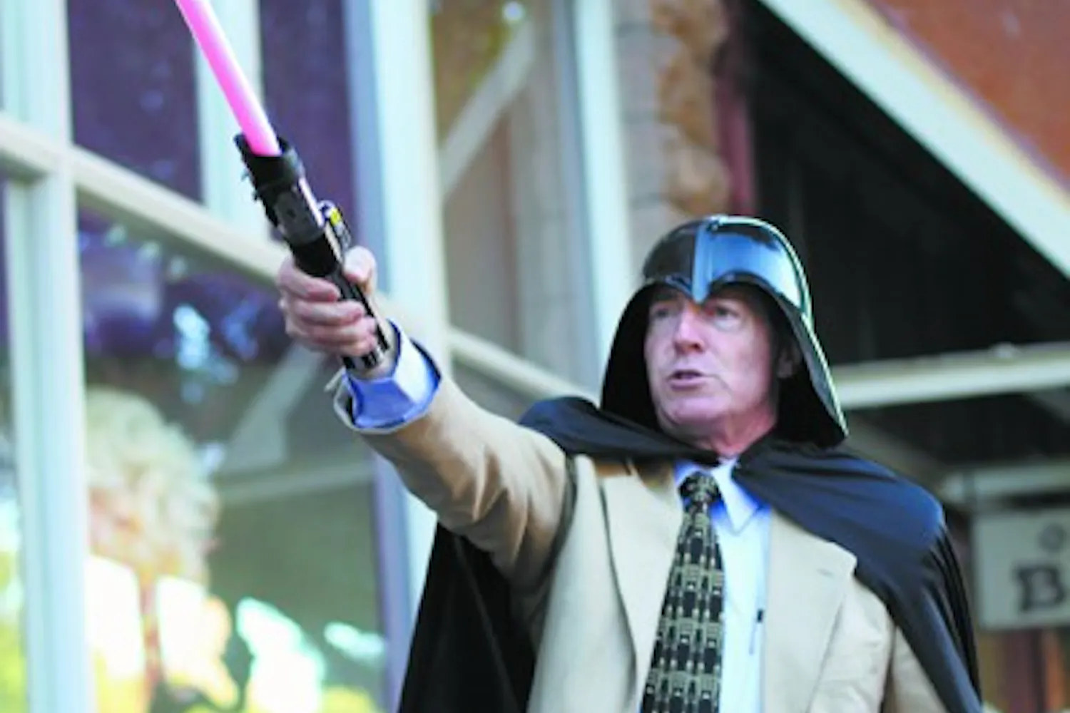 Dressed as Darth Vader, Tempe Mayor Hugh Hallman leads a pack of Star Wars fanatics down Mill Avenue late Friday afternoon to film a promotional video for the upcoming Geeks Night Out. (Photo by Sam Rosenbaum)