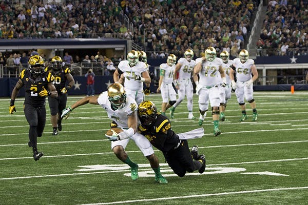 Graduate defensive back Osahon Irabor makes a tackle on senior wide receiver TJ Jones. ASU lost 34-37 at the Shamrock classic in Dallas, Texas. (Photo by Dominic Valente)
